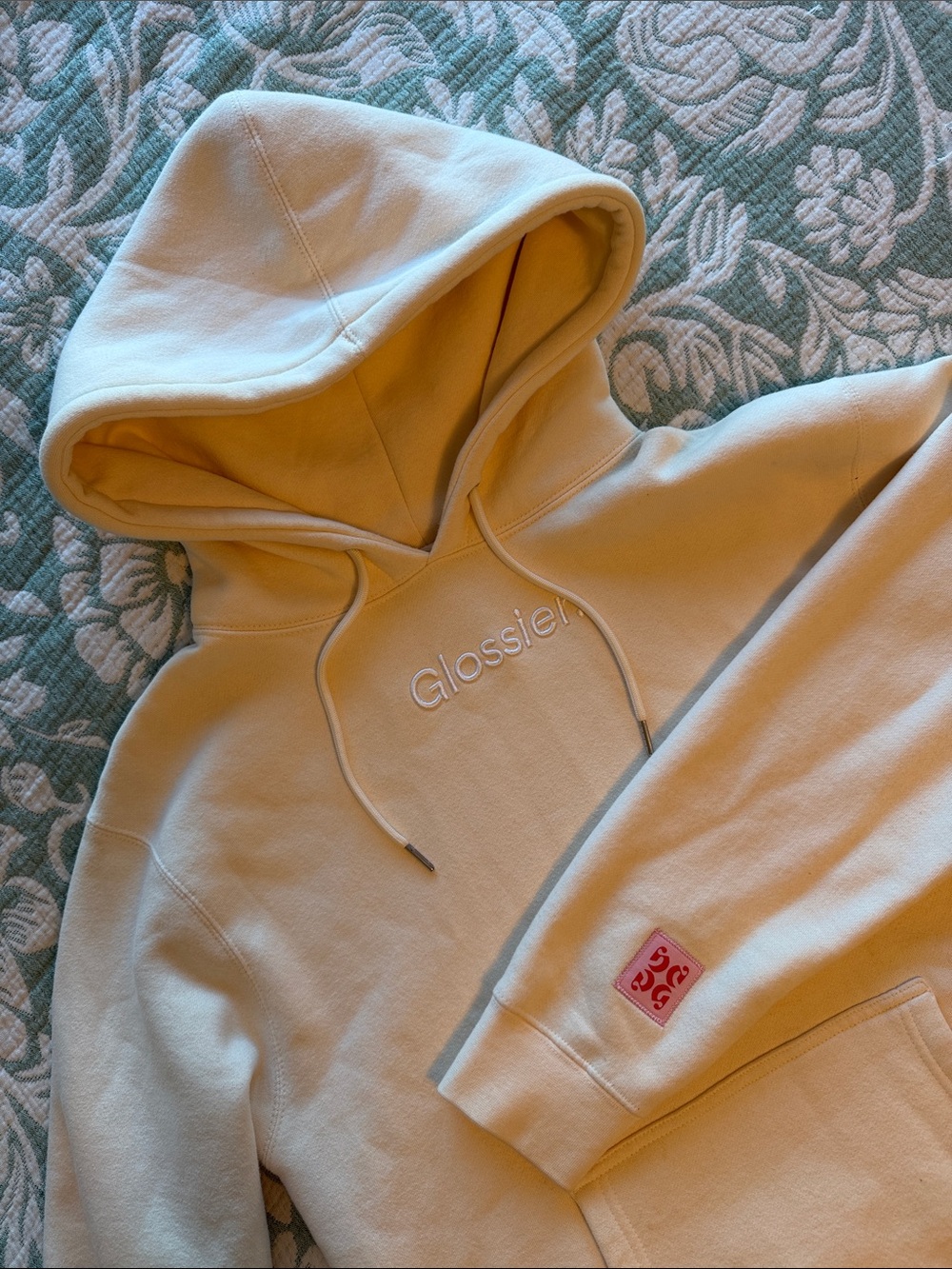 Glossier Cream Hoodie with Subtle Logo